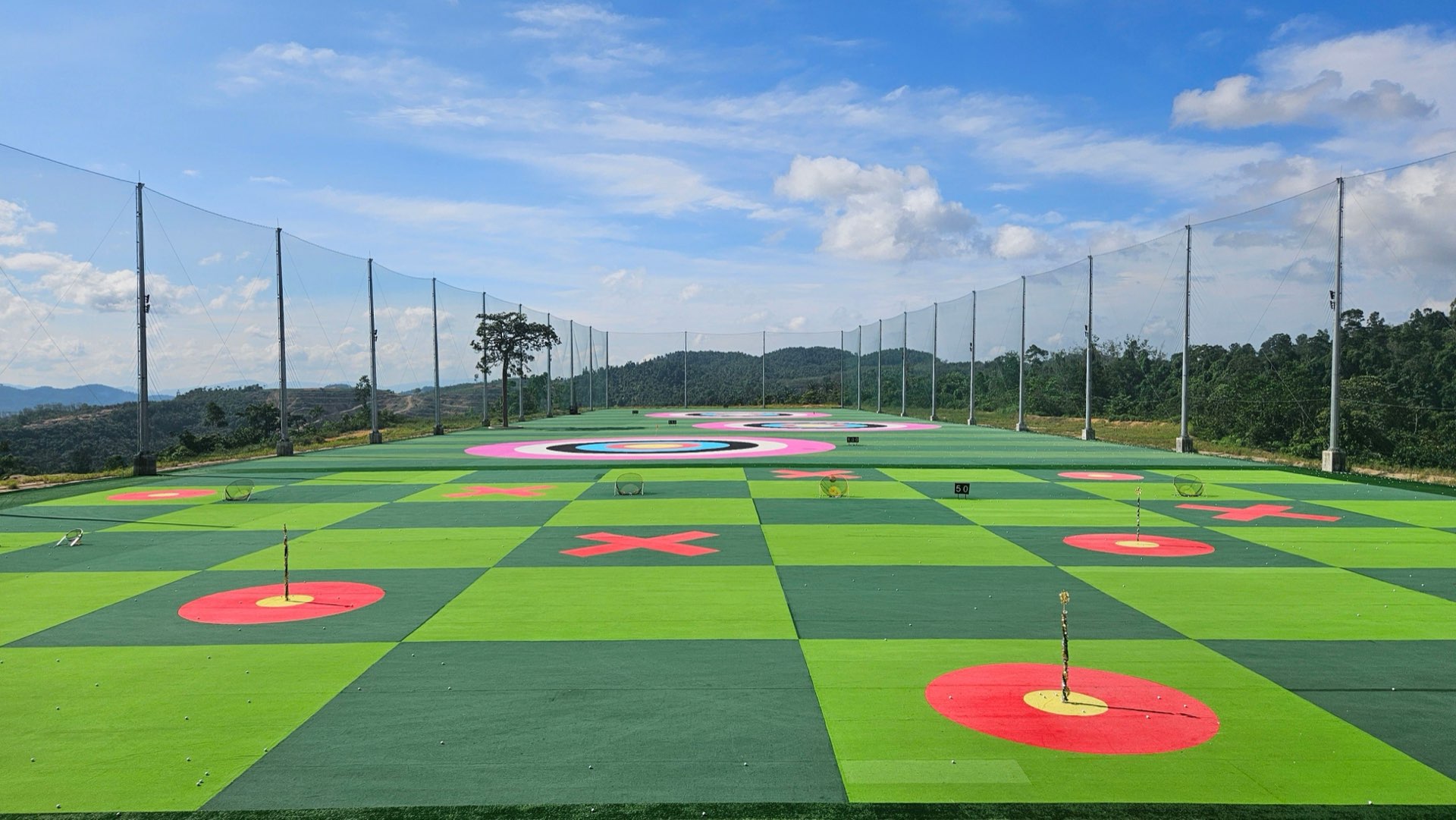 Open-air target range with coloured targets on artificial turf